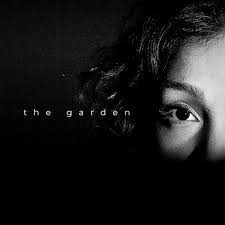 album cover for sahn's 'the garden'. Shows one quarter of sahn's face in black and white with "the garden" to the left.